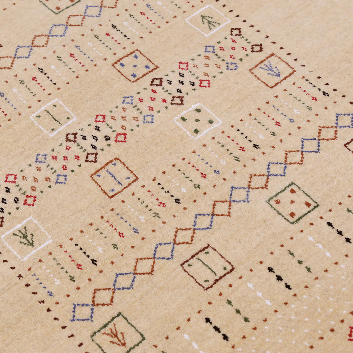 Close-up texture of beige Hand Woven Loom Lori wool rug showing natural wool fibres and detailed tribal motifs