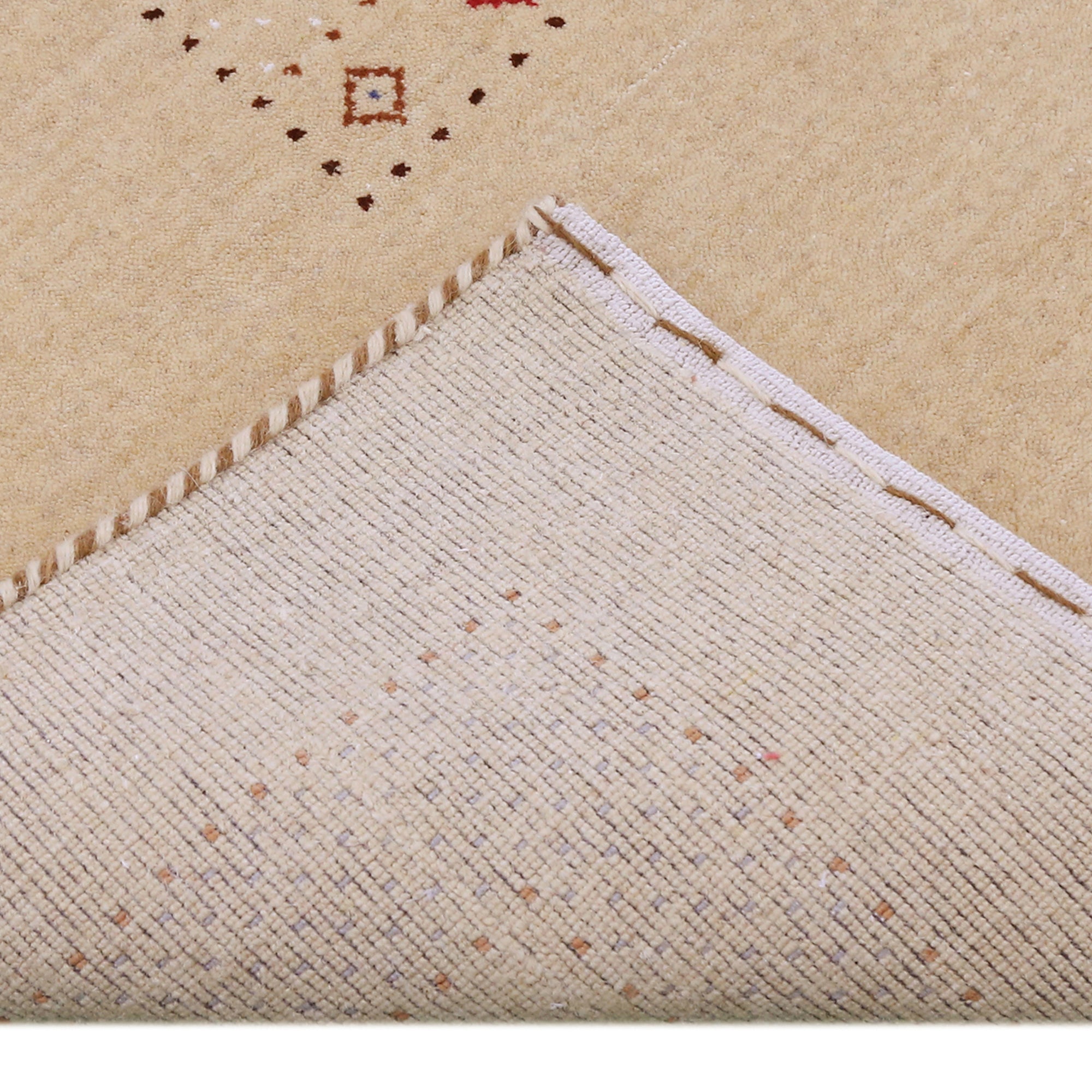 Corner and edge detail of beige Hand Woven Loom Lori wool rug showing patterned border and handcrafted finishing
