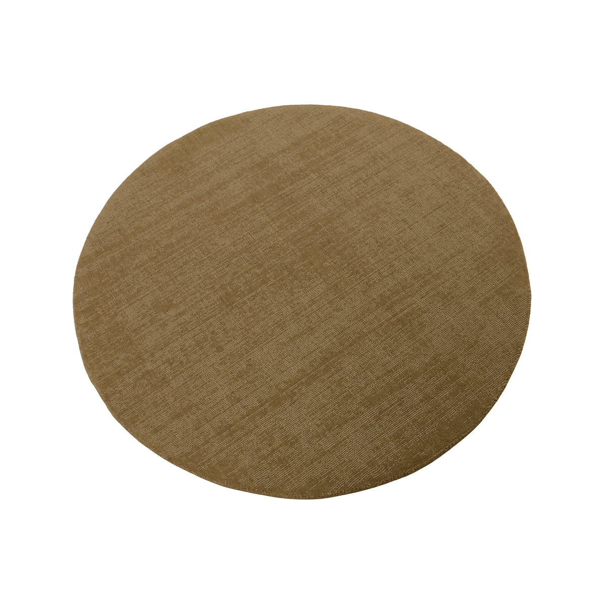 Angled view of beige round Loom Lori wool rug highlighting its circular silhouette, earthy beige tone and refined surface texture.