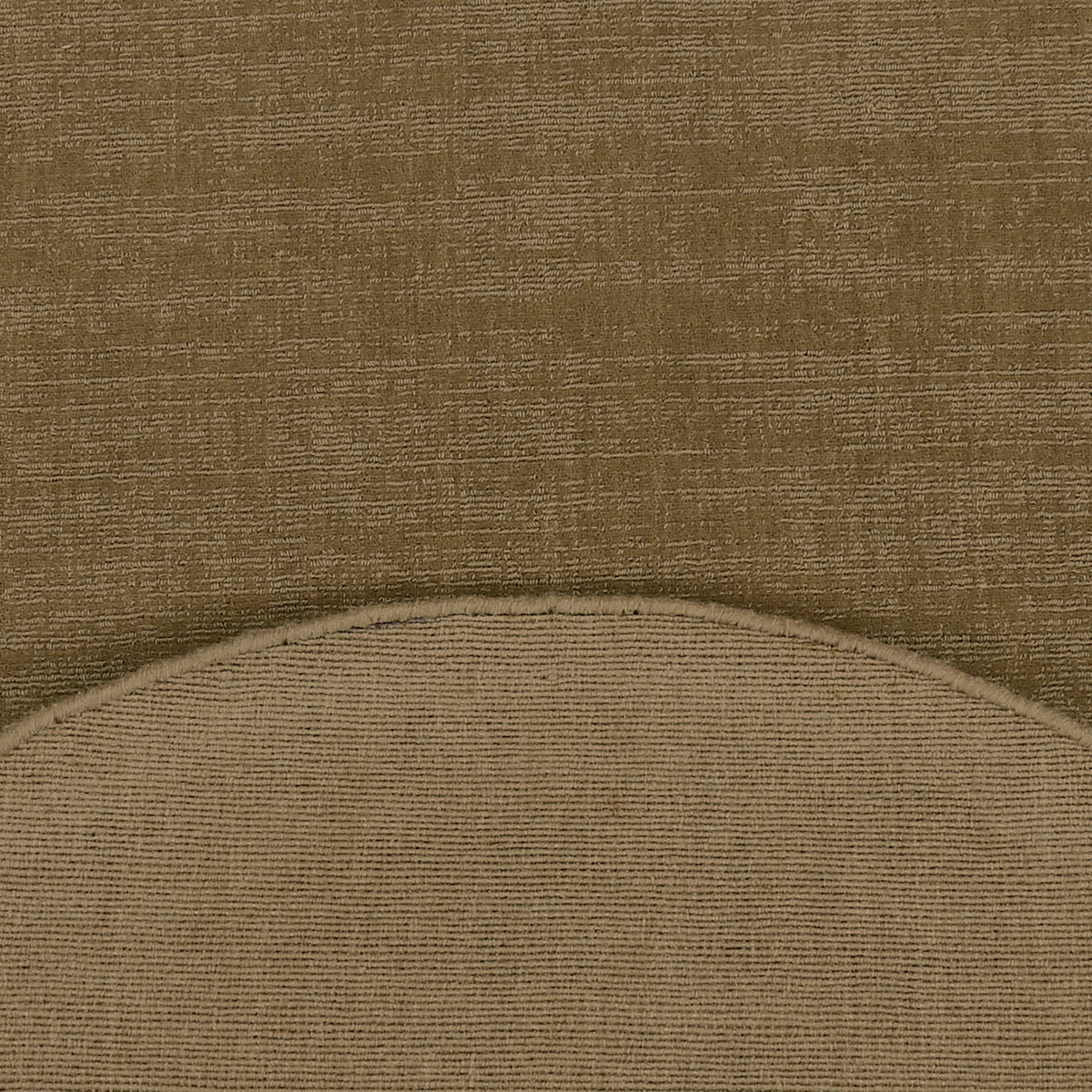 Close-up of beige Hand Woven Loom Lori wool rug showing the textured wool surface, finished curved edge and woven underside.