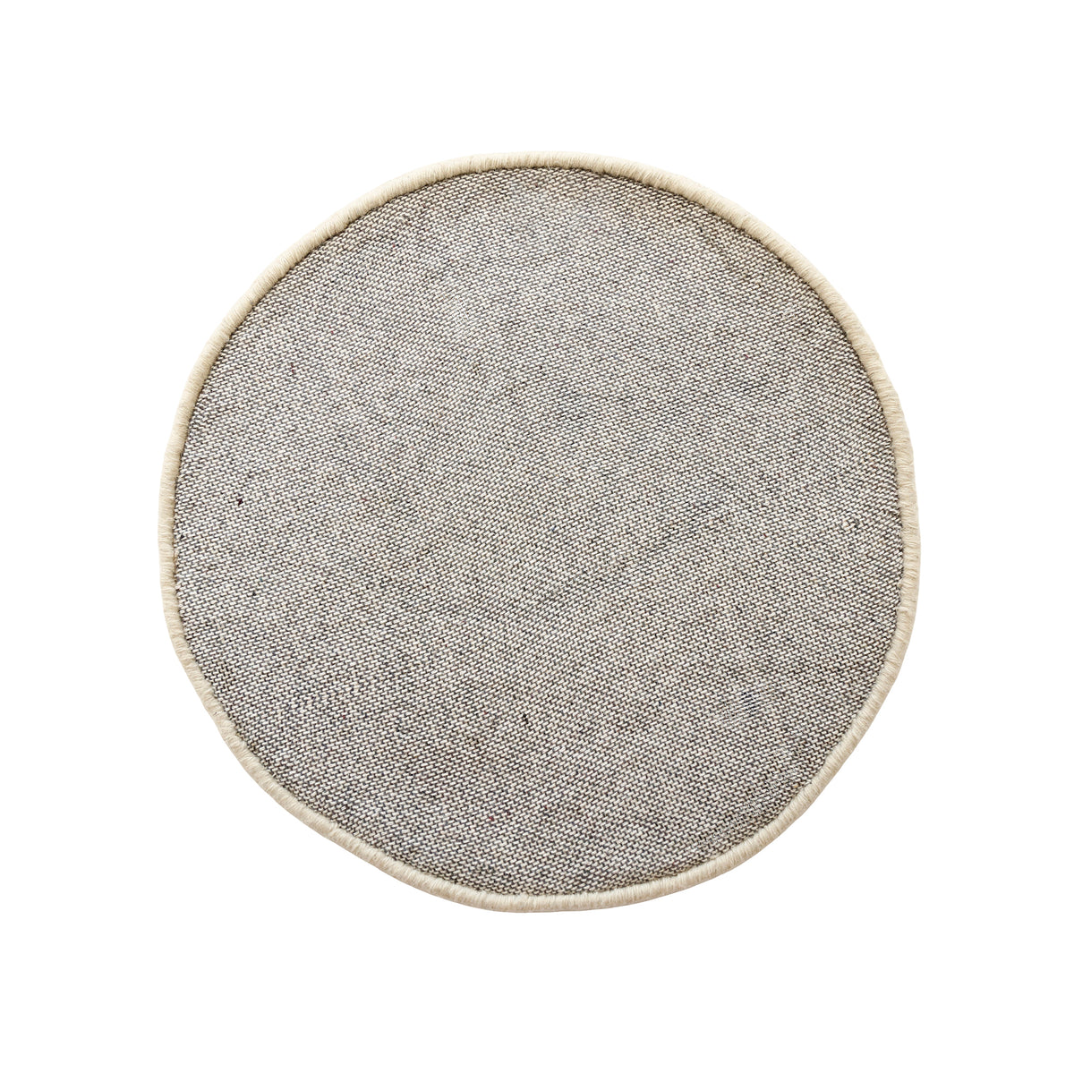 Side angle view of beige smiley face wool kids rug showing its round shape, plush 12-15 mm hand tufted pile and playful cartoon design.