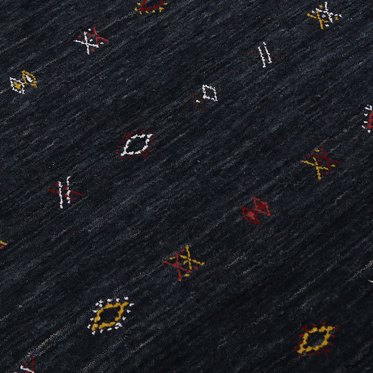 Close-up of charcoal black Hand Woven Loom Lori wool rug showing natural wool texture and multicolour geometric tribal motifs