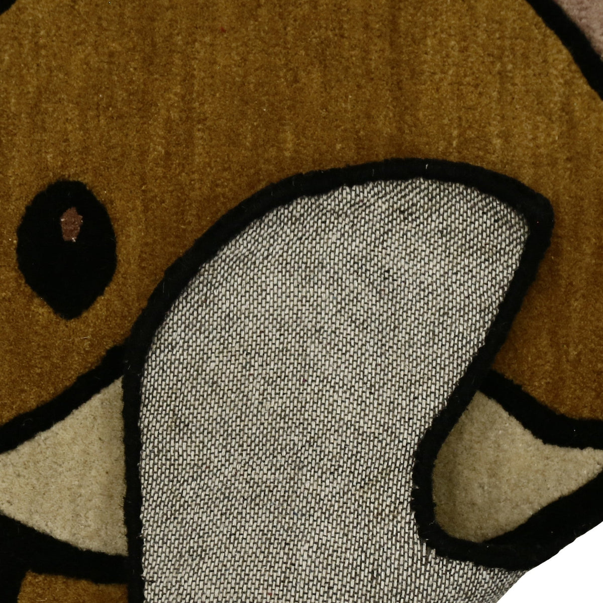 Corner and edge detail of brown fox hand tufted wool kids rug showing its shaped outline, plush 12-15 mm pile and neat finishing.