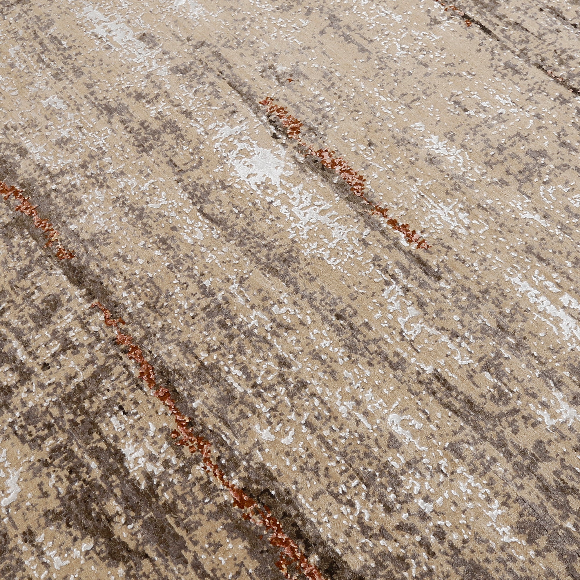 Close-up of the hand knotted wool and viscose texture with beige taupe brown and copper-rust abstract detailing