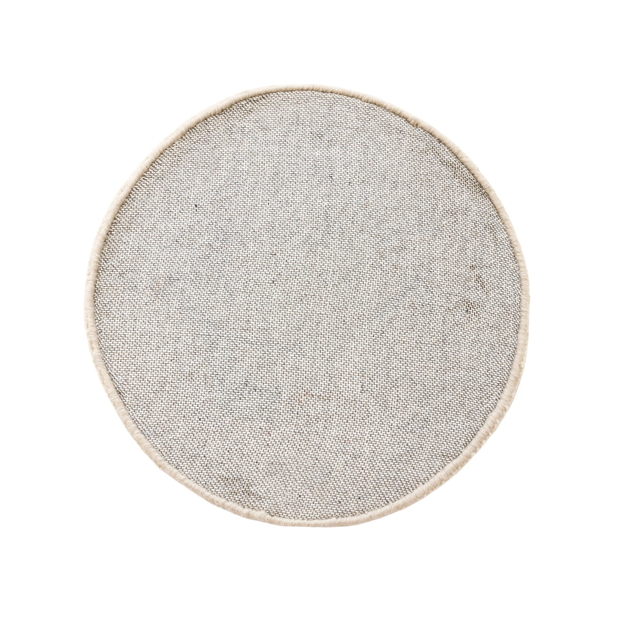 Side angle view of cream happy face wool kids rug showing its round shape, plush 12-15 mm hand tufted pile and playful cartoon design.