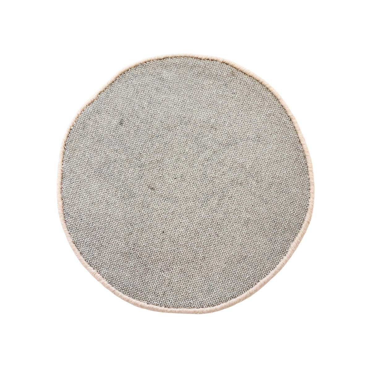 Side angle view of cream happy face wool kids rug showing its round shape, plush 12-15 mm hand tufted pile and playful cartoon design.