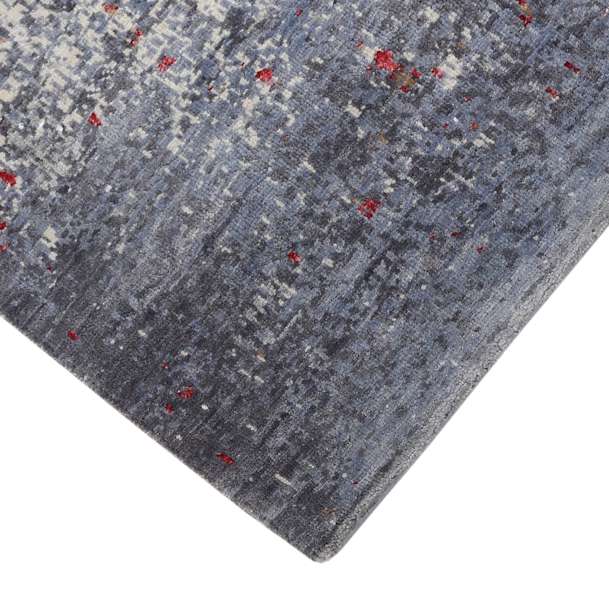 Hand-finished edge and softly distressed surface of the Crimson Mist hand knotted modern runner rug