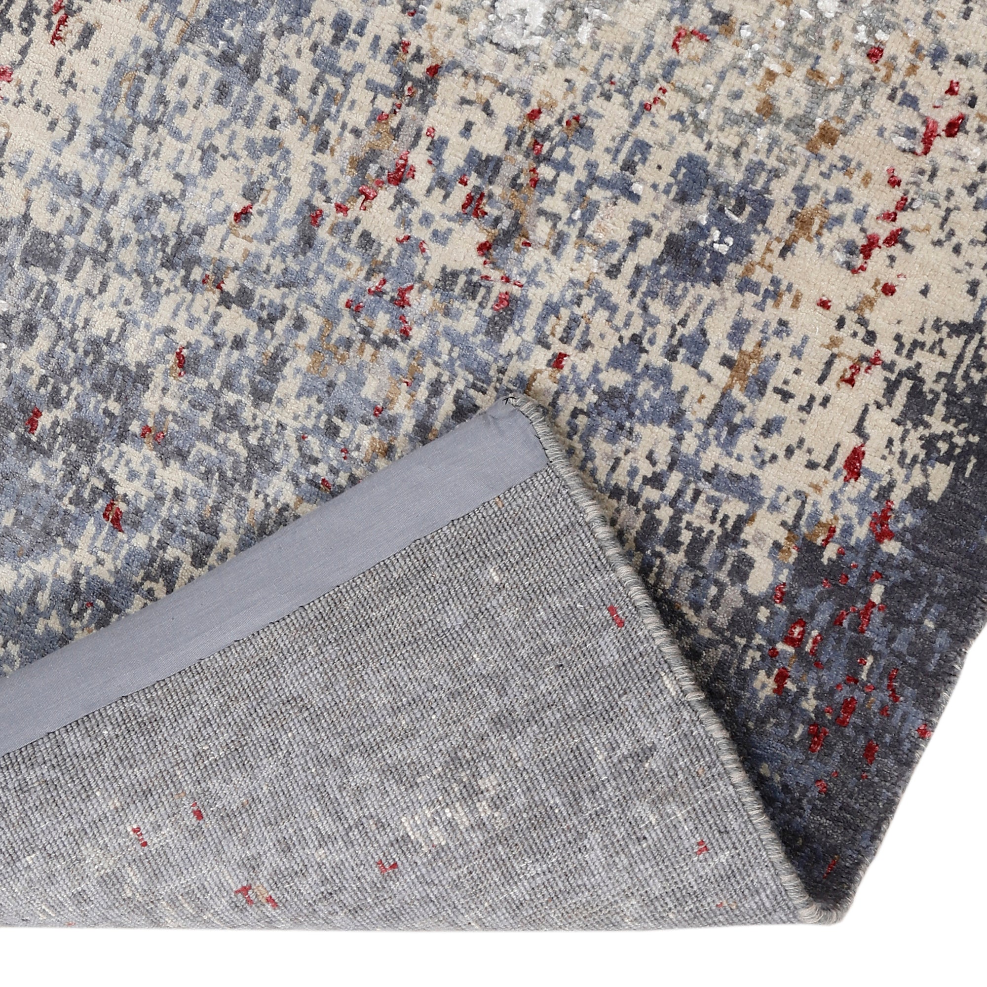 Hand-finished edge and softly distressed surface of the Crimson Mist hand knotted modern runner rug