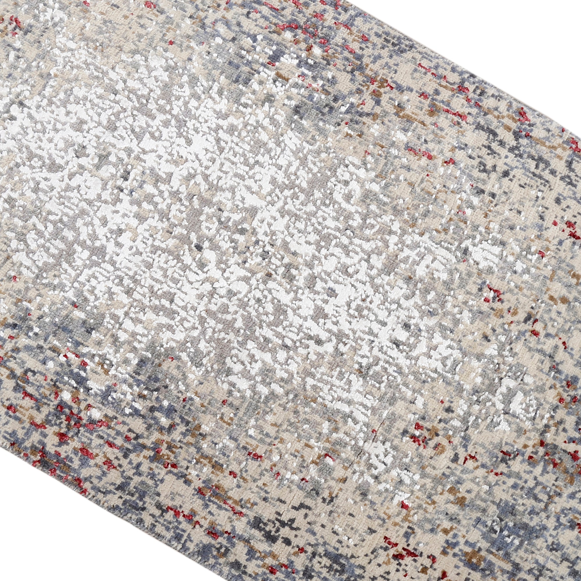 Close-up of Crimson Mist hand knotted runner rug texture with silver grey ivory and crimson abstract detailing