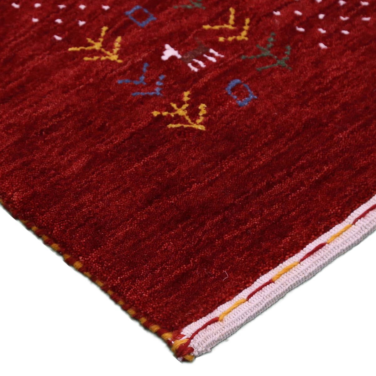 Full view of crimson red Hand Woven Loom Lori wool rug with spacious centre and multicolour dotted tribal folk border
