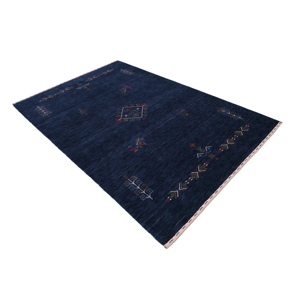 Side perspective of deep navy blue Hand Woven Loom Lori wool rug highlighting handcrafted texture and central tribal medallion design