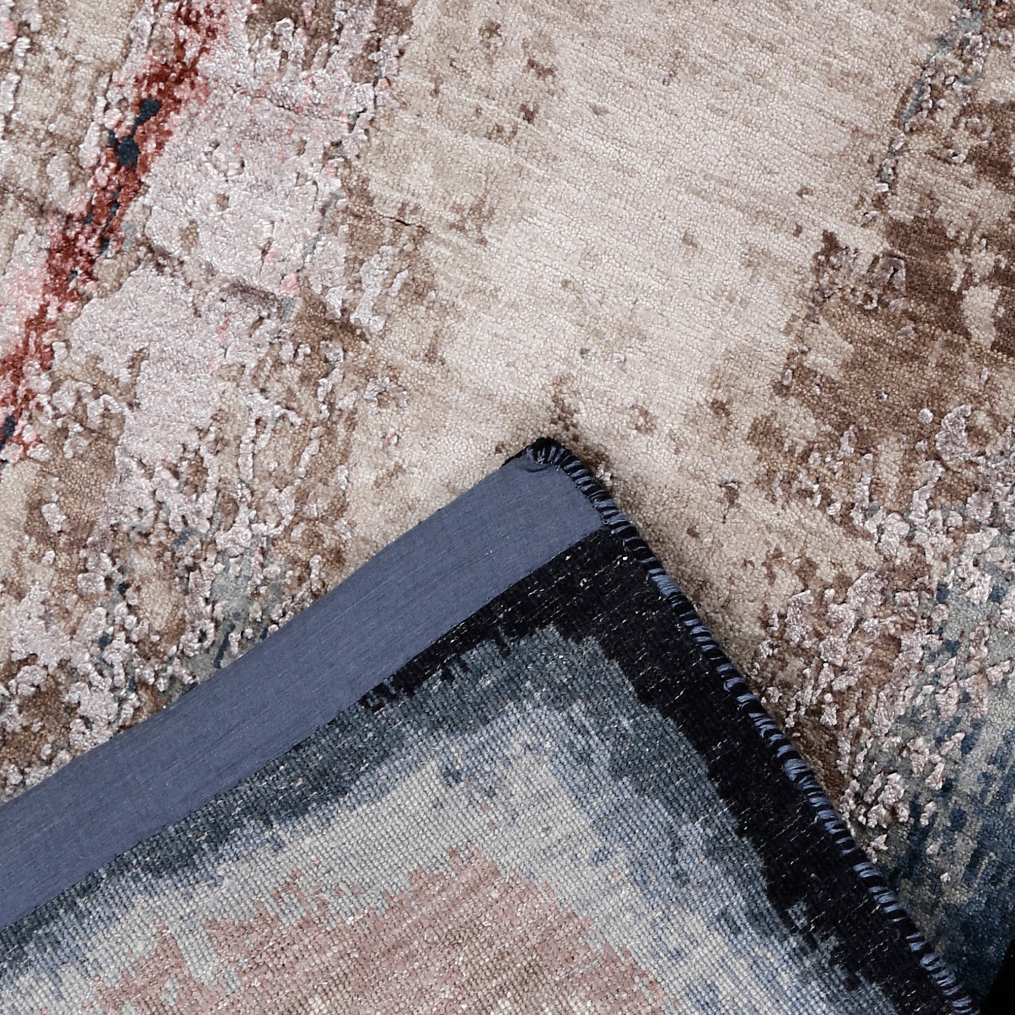 Dark hand-finished border and distressed surface of the Ivory Shadow hand knotted modern runner rug