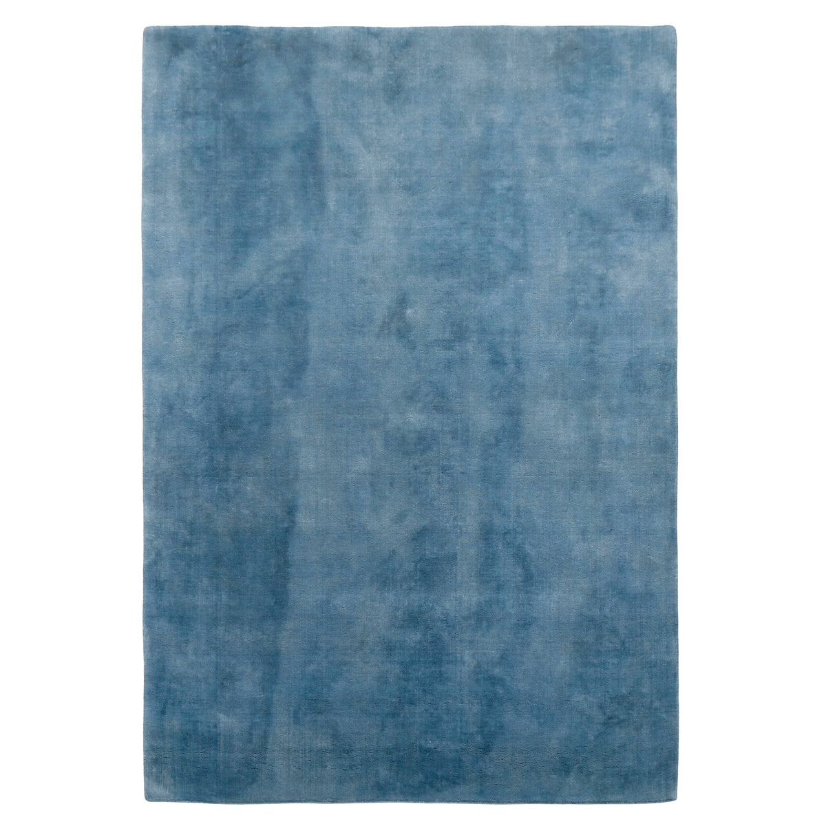 Full view of light blue rectangular hand woven Loom Lori wool rug featuring a clean plain design and soft tonal variations.