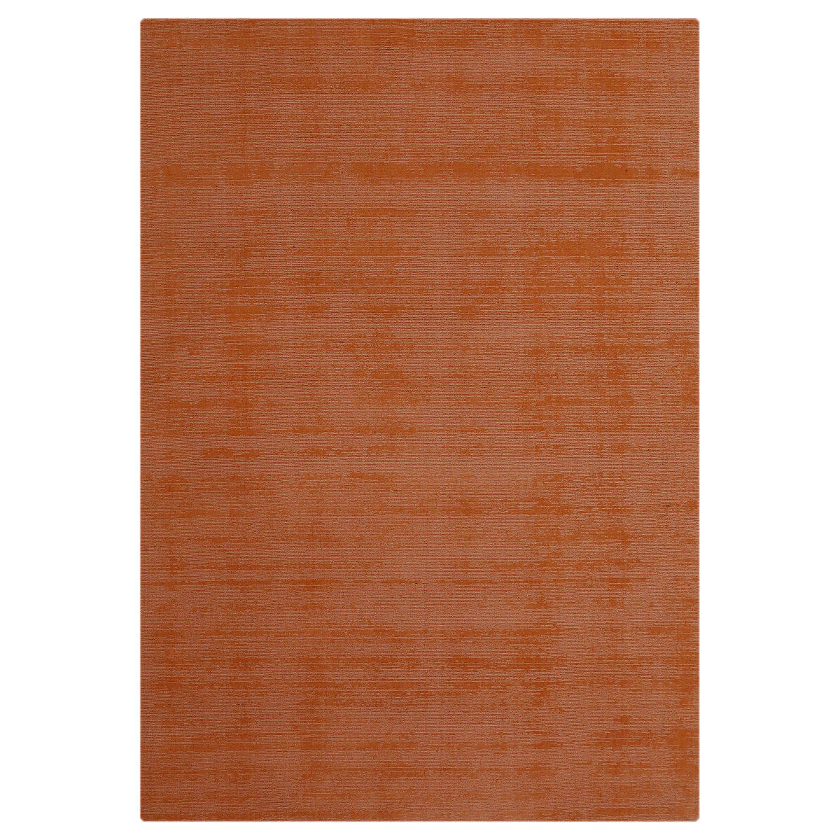 Full view of light pink rectangular hand woven Loom Lori wool rug featuring a clean plain design with subtle tonal surface variations.