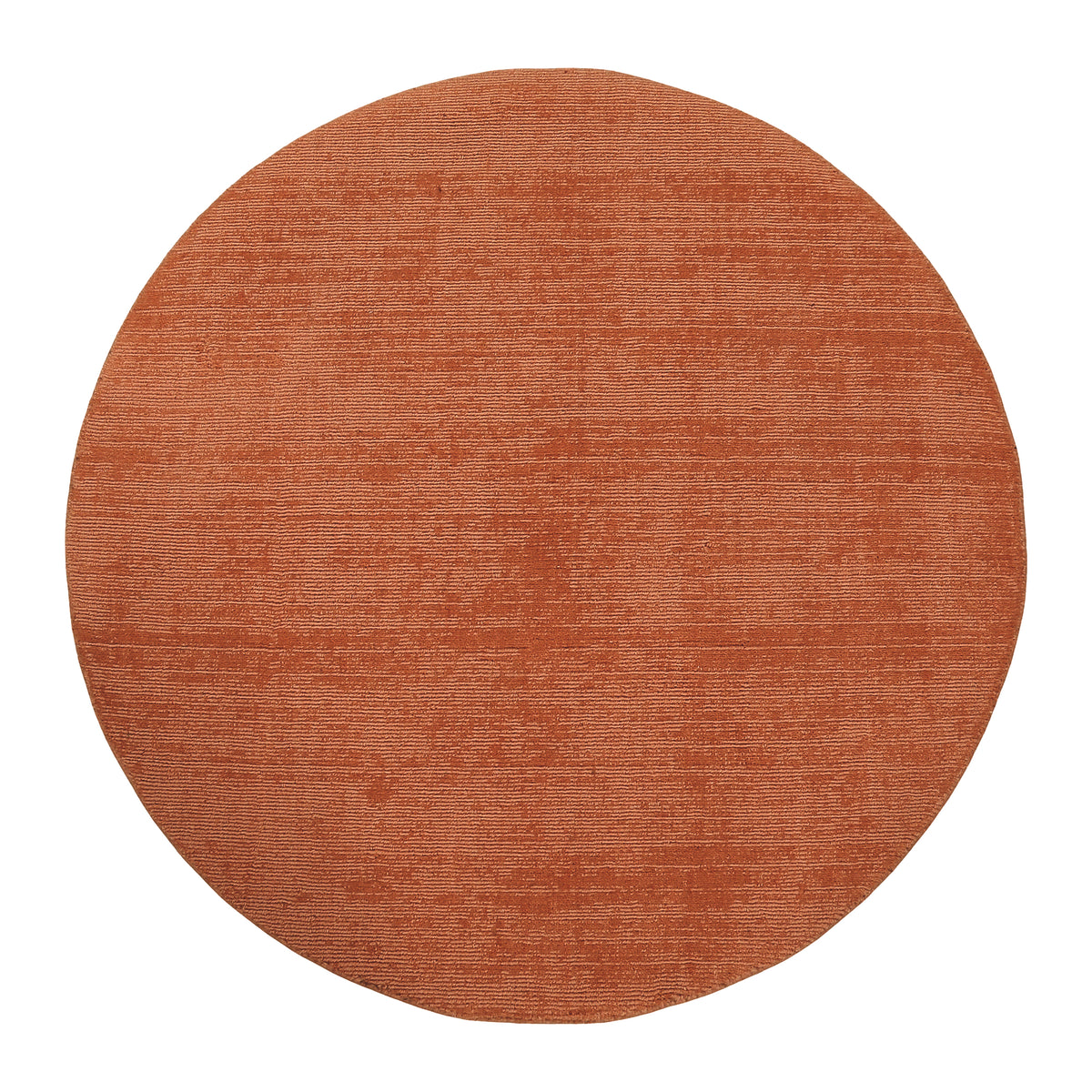 Full view of light pink round hand woven Loom Lori wool rug featuring a clean plain design, circular shape and subtle tonal texture.