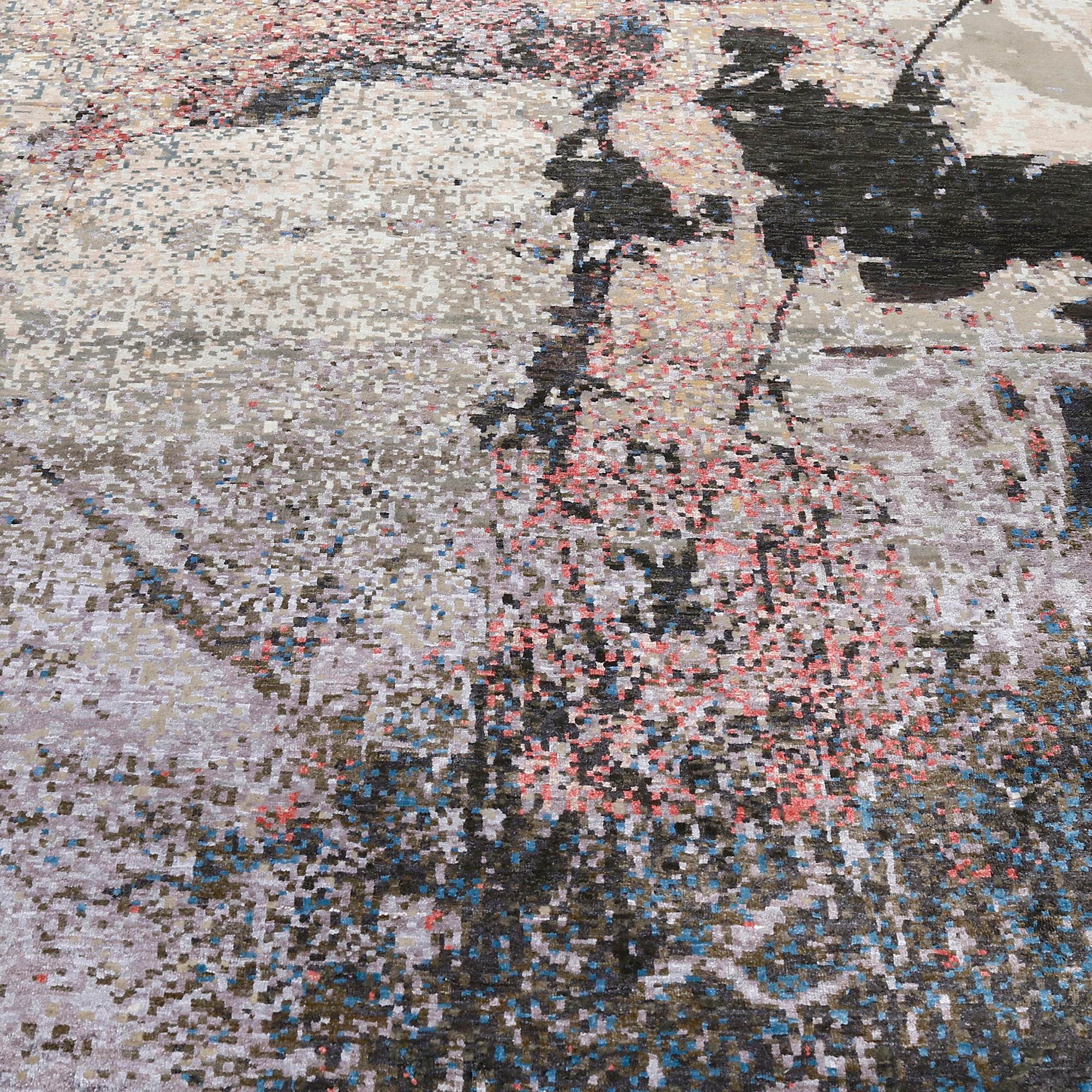 Close-up of the hand knotted wool and viscose texture with charcoal ivory beige and blush abstract detailing