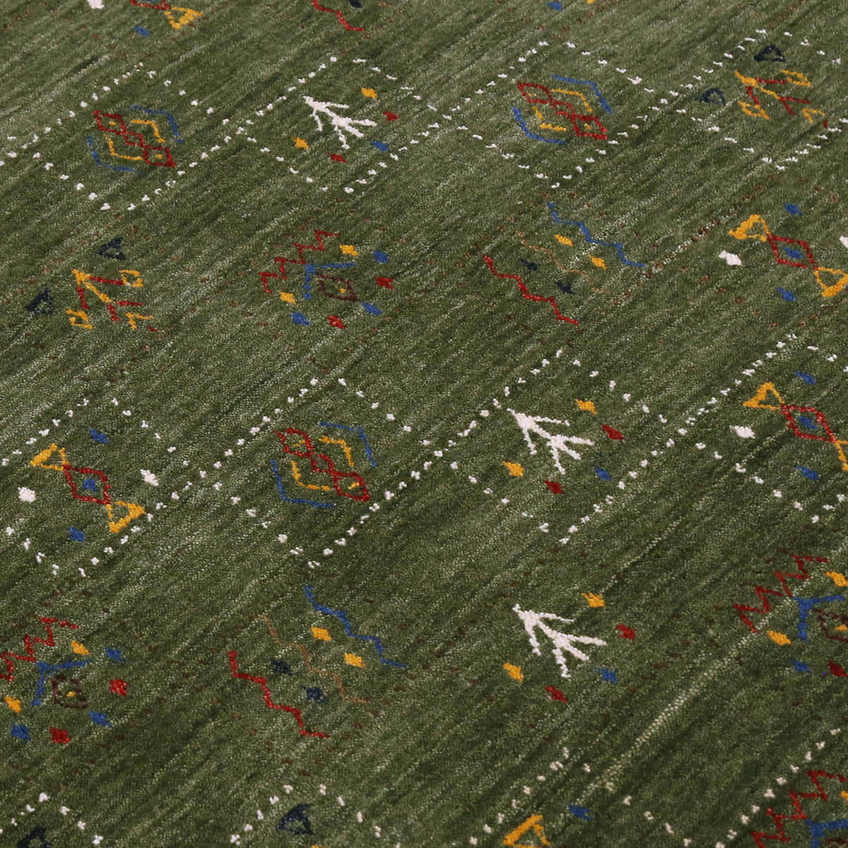 Close-up of olive green Hand Woven Loom Lori wool rug showing natural texture, framed geometric motifs and colourful tribal symbols