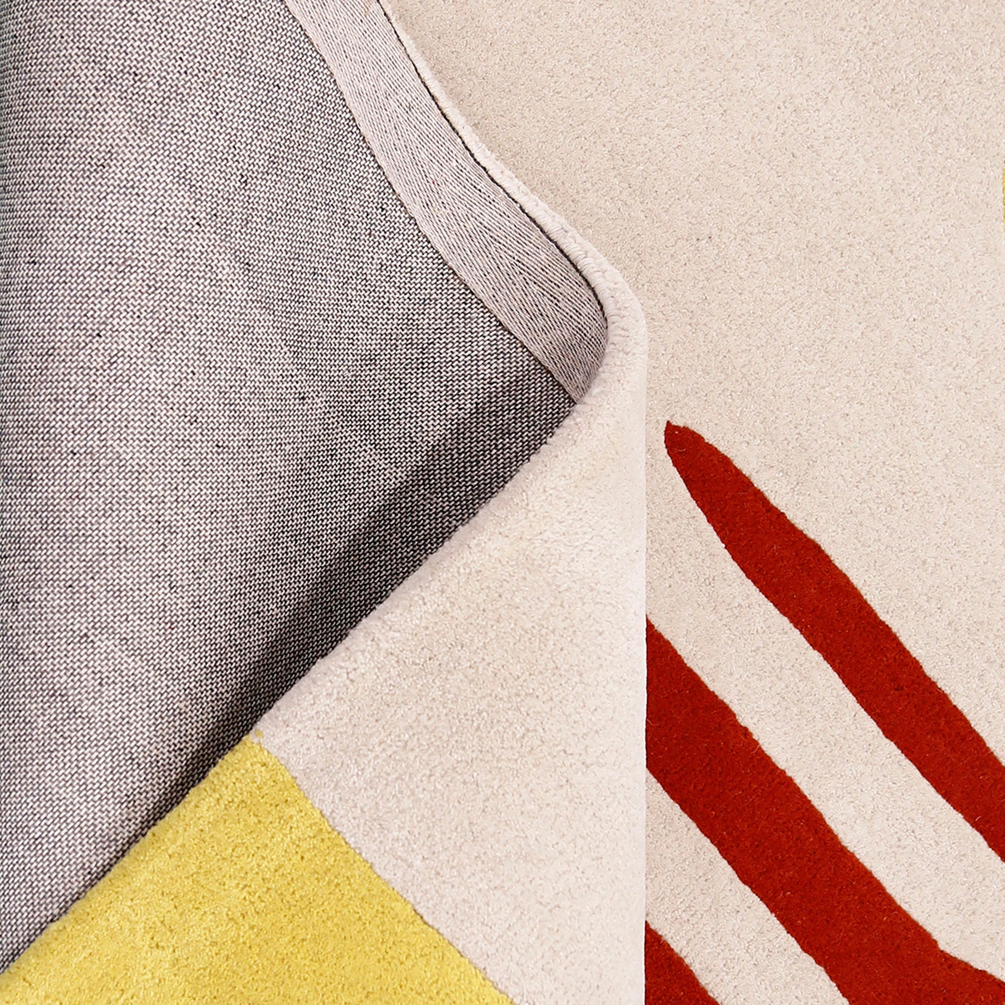 Close-up texture of the red hat lady hand tufted wool wall rug