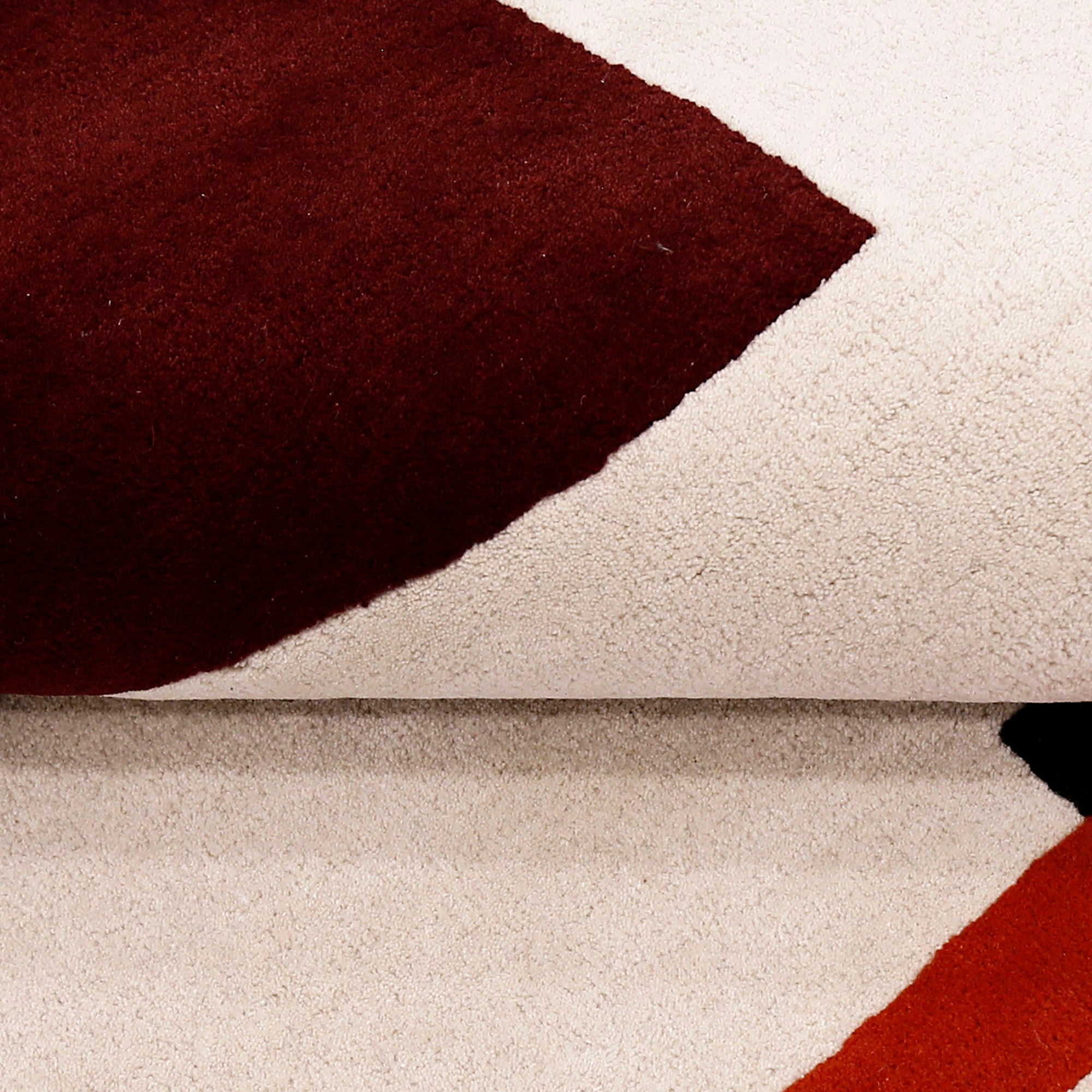 Close-up texture of the red hat lady hand tufted wool wall rug