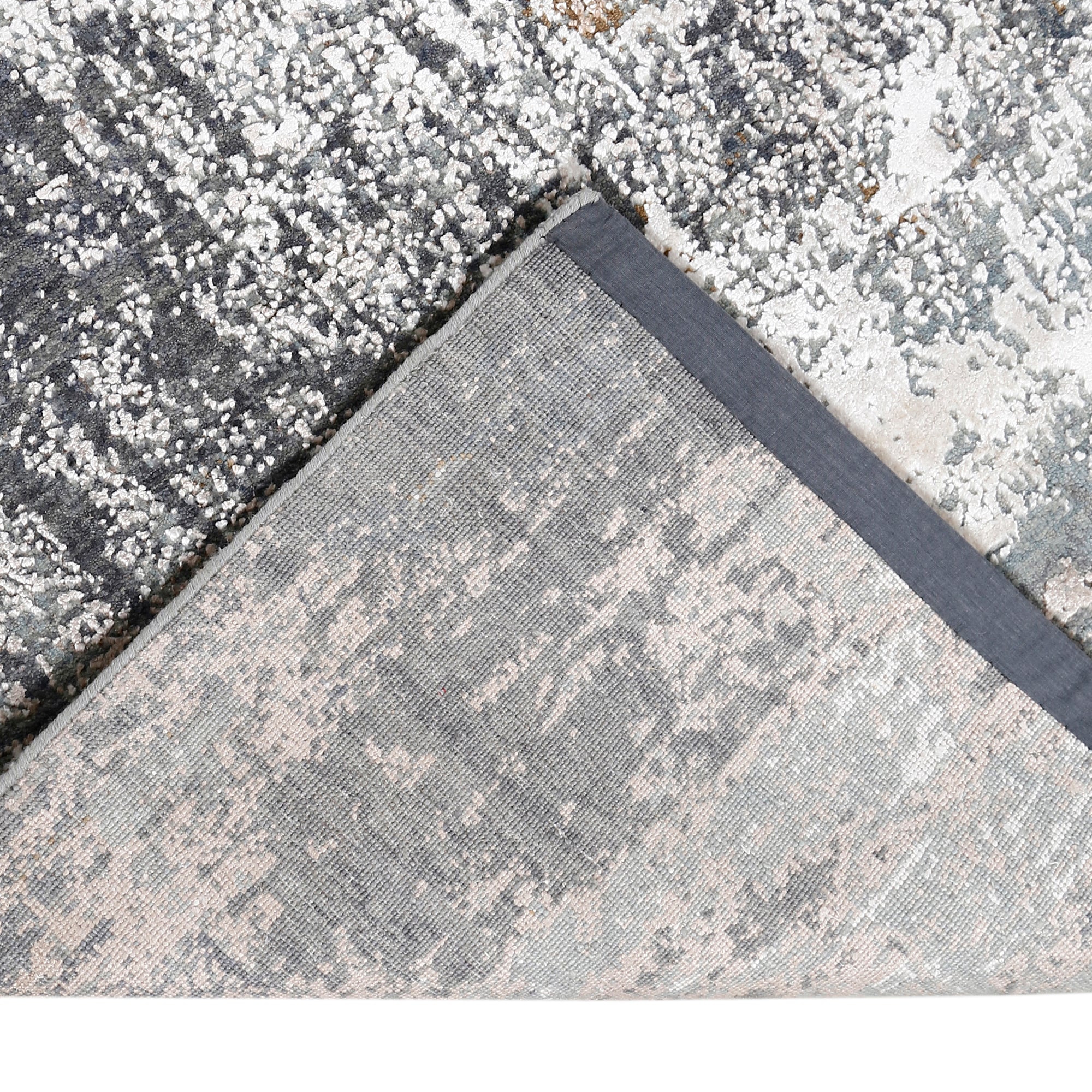 Hand-finished edge and layered distressed detailing of the silver taupe abstract hand knotted rug