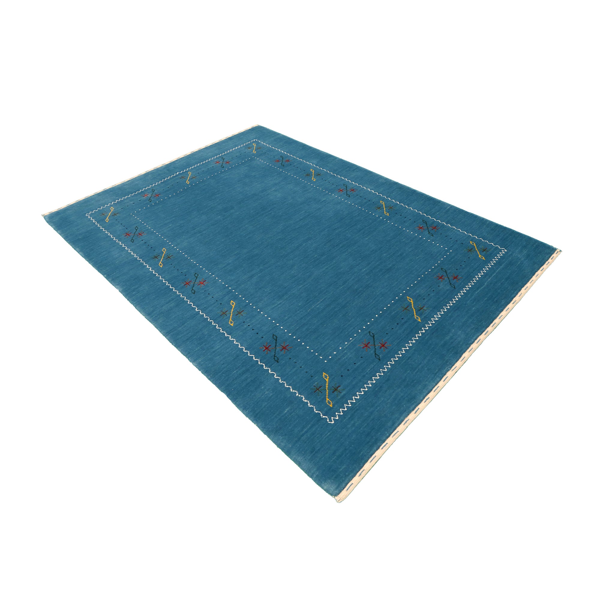Side angle view of teal blue Hand Woven Loom Lori wool rug highlighting natural wool texture, minimal floral pattern and handmade finish