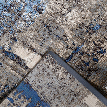 Hand-finished edge and textured abstract surface of the Azure Terrain hand knotted modern rug