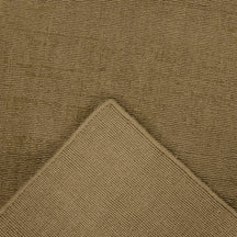 Close-up of Beige Loom Lori wool runner rug showing the handcrafted surface, bound edge and woven underside construction.