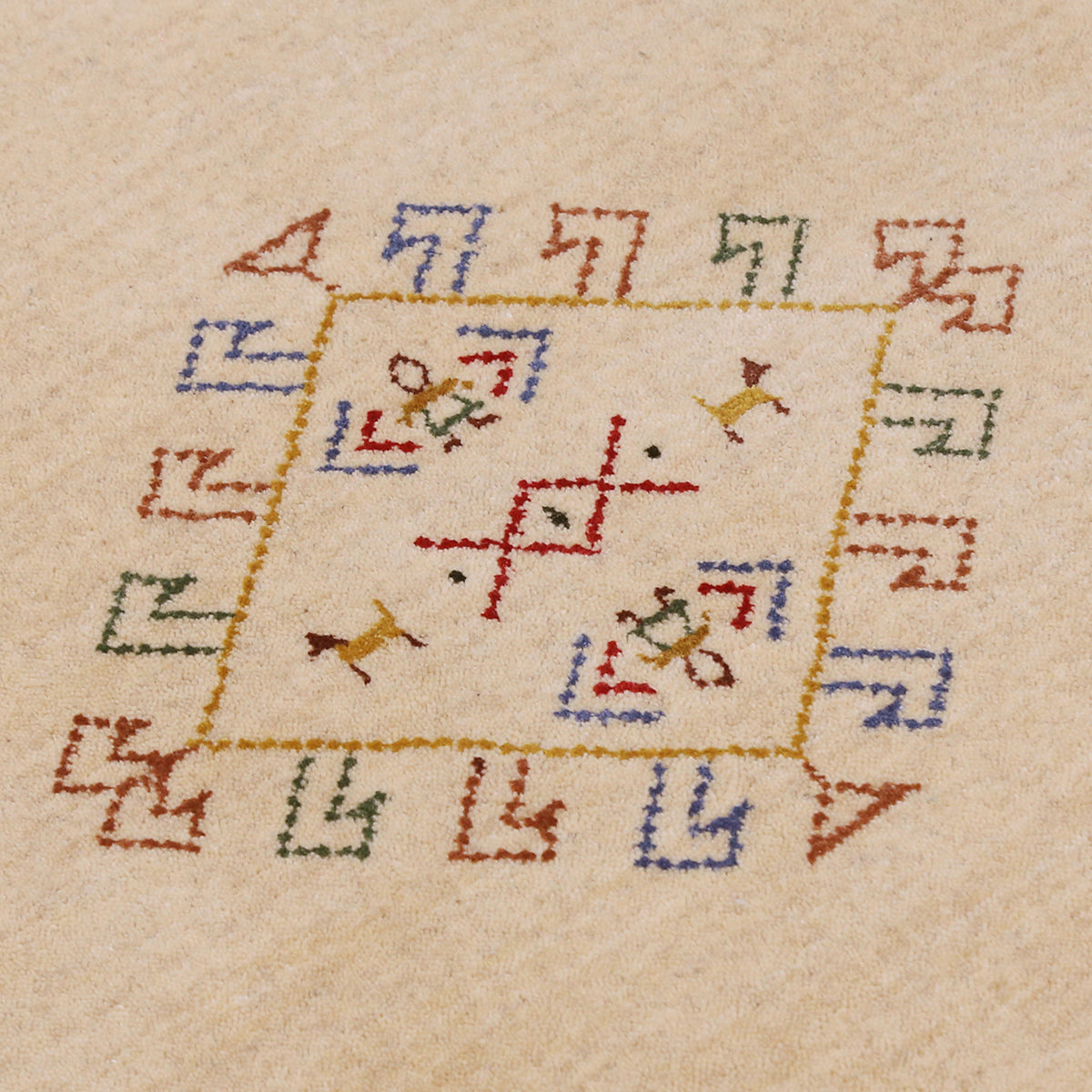 Close-up of beige Hand Woven Loom Lori wool rug showing natural wool texture and delicate tribal motif detailing