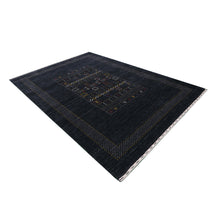 Side angle view of black Hand Woven Loom Lori wool rug highlighting wool texture, tribal geometric pattern and handmade finish