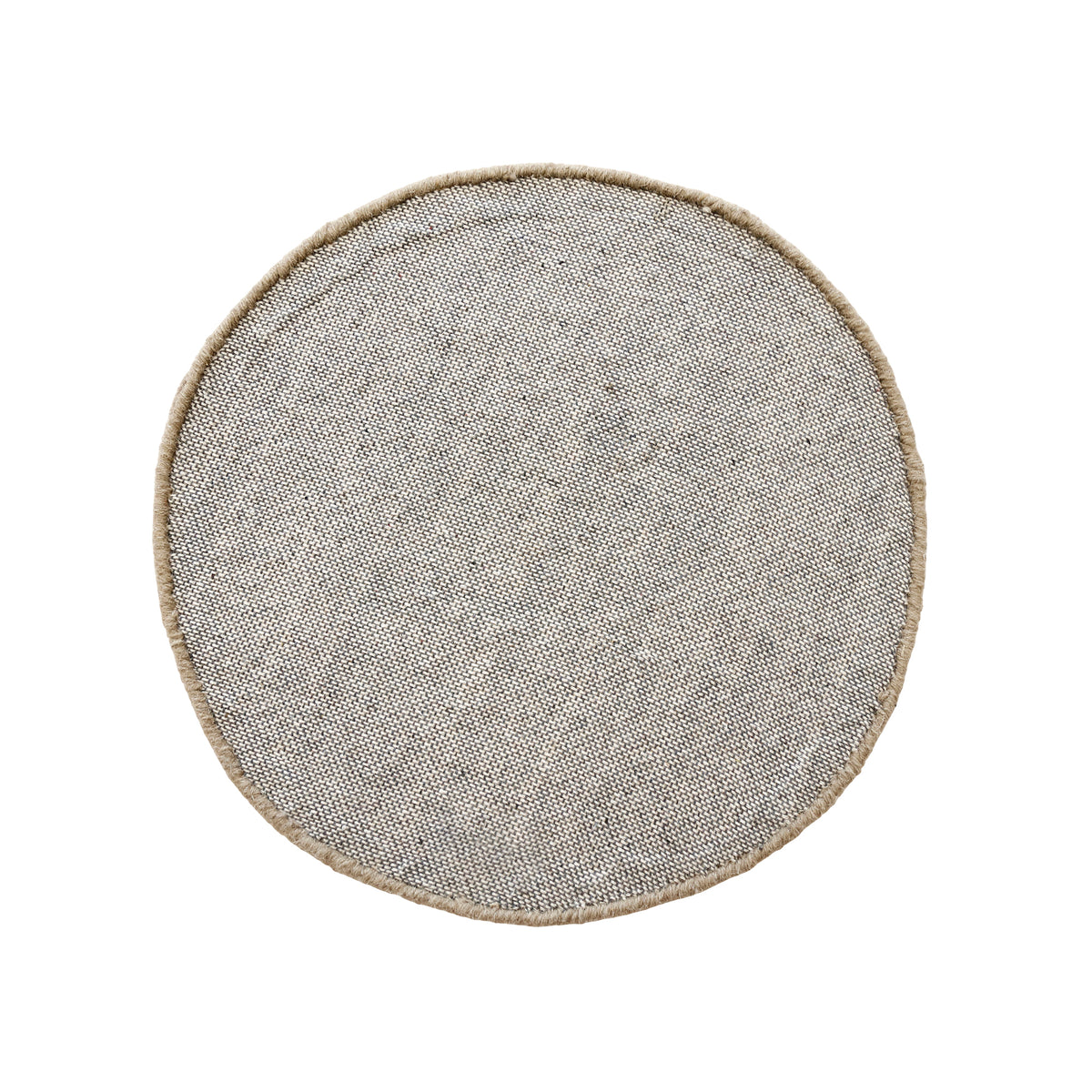 Side angle view of brown happy face wool kids rug showing its round shape, plush 12-15 mm hand tufted pile and playful cartoon design.