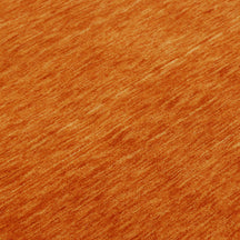 Close-up of burnt orange Hand Woven Loom Lori wool rug showing natural wool texture and detailed geometric tribal motifs