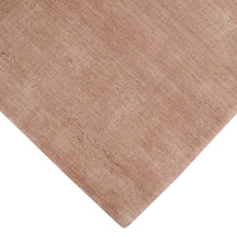 Corner and edge detail of camel hand woven Loom Lori wool rug showing its neat finishing, soft surface and plush 12–15 mm pile.