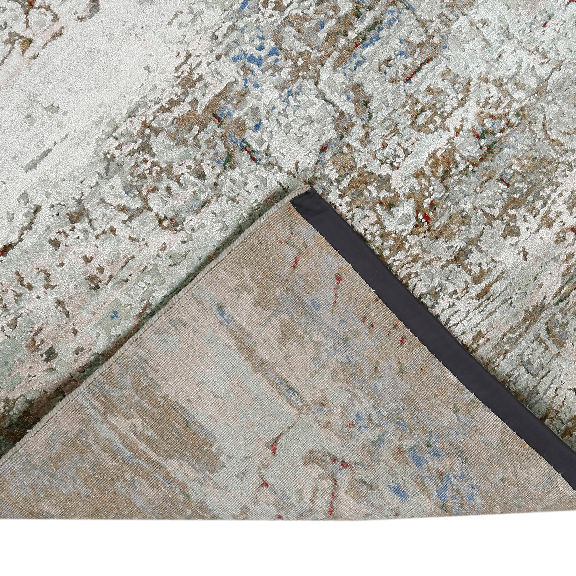 Hand-finished edge and layered distressed detailing of the cloudstone blue abstract hand knotted rug