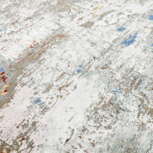 Close-up of the hand knotted wool and viscose texture with ivory beige blue and gold abstract detailing