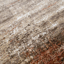 Close-up of the hand knotted wool and viscose texture with beige taupe brown and copper-rust abstract detailing