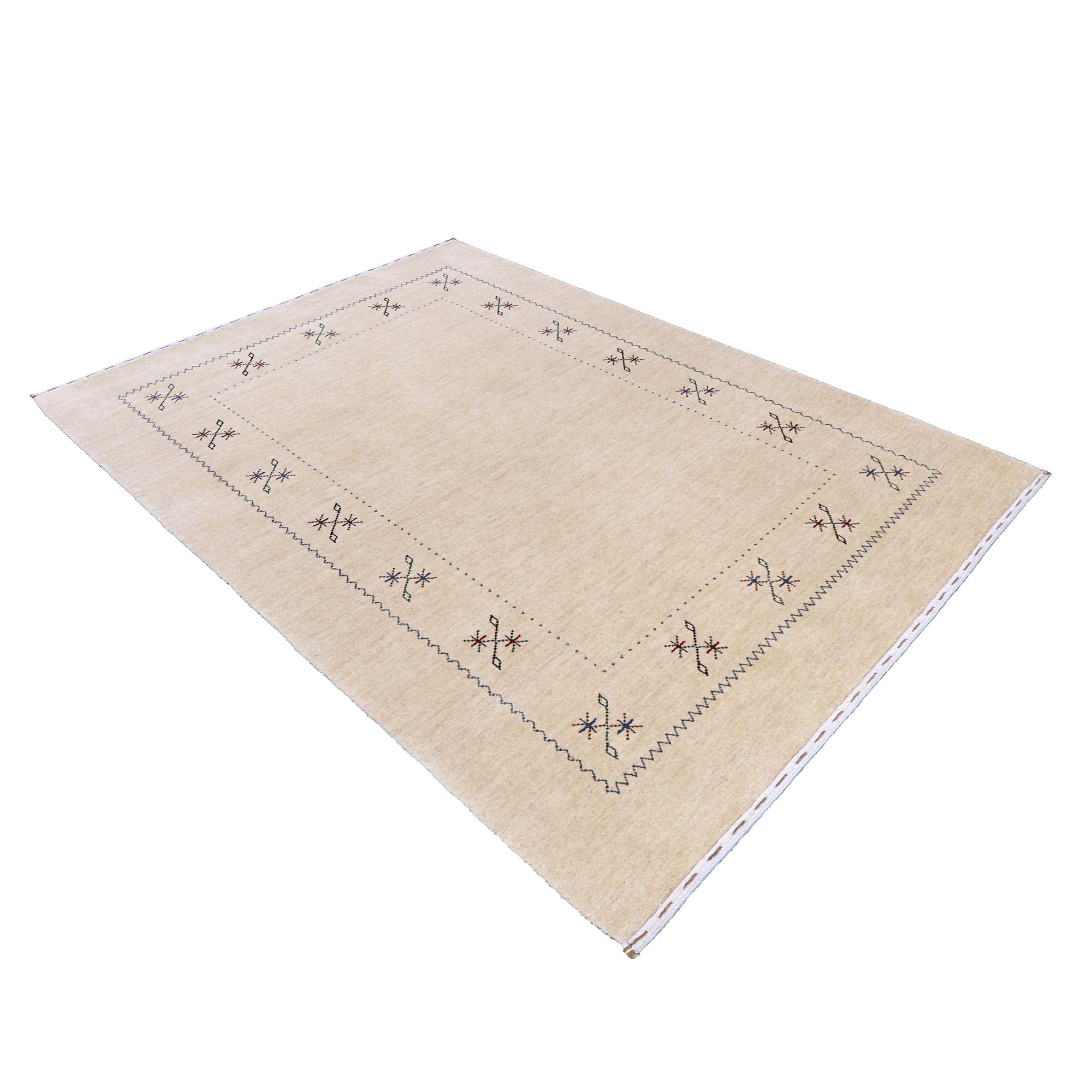 Side angle view of cream Hand Woven Loom Lori wool rug highlighting natural wool texture, minimal floral pattern and handmade finish
