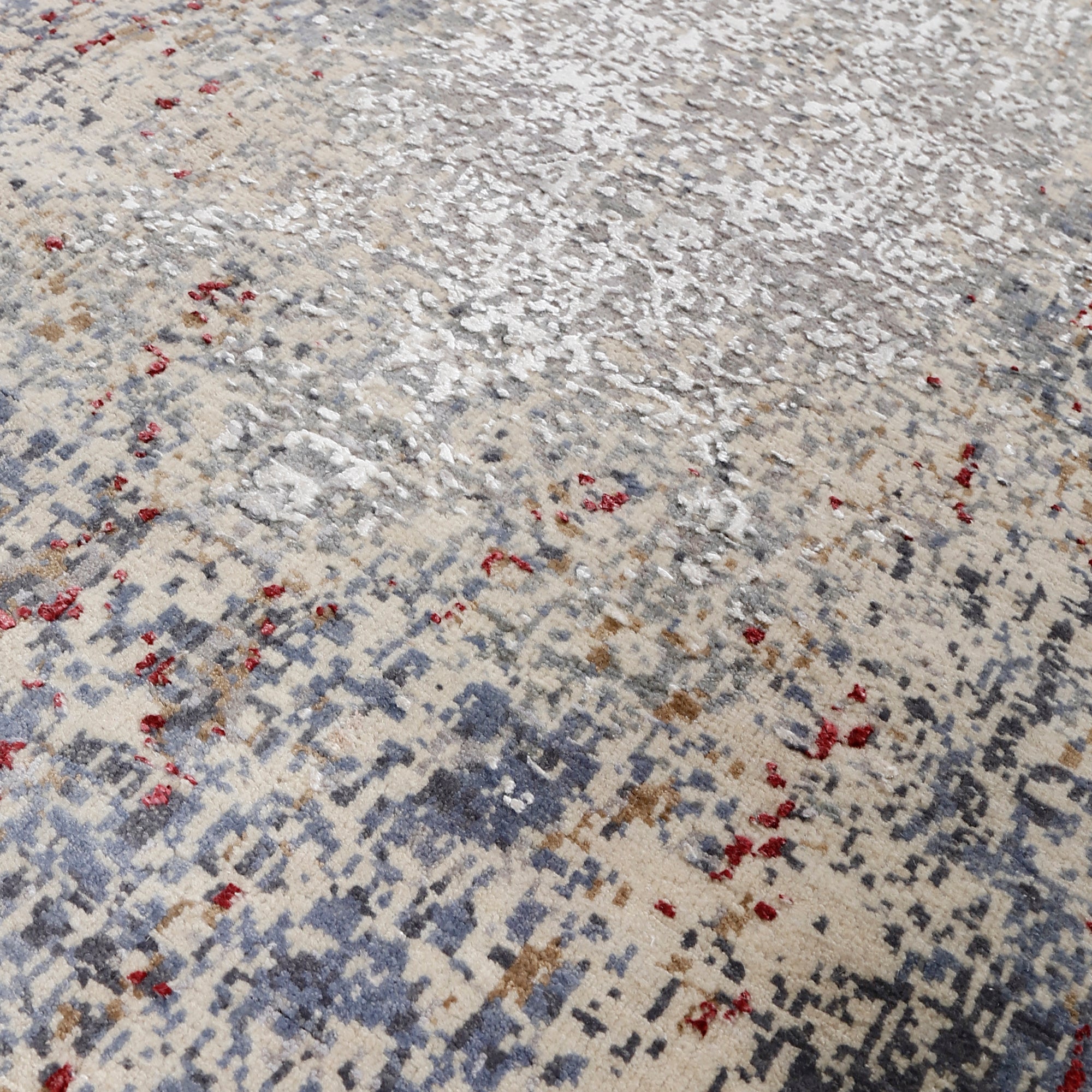 Close-up of Crimson Mist hand knotted runner rug texture with silver grey ivory and crimson abstract detailing