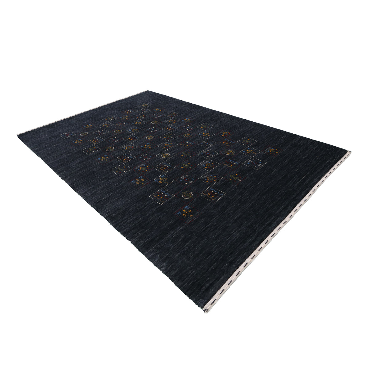 Side perspective of charcoal black Hand Woven Loom Lori wool rug highlighting handcrafted wool texture and minimal central motif layout