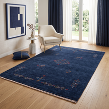 Deep navy blue Hand Woven Loom Lori wool rug with central diamond tribal medallion styled in an elegant contemporary living room