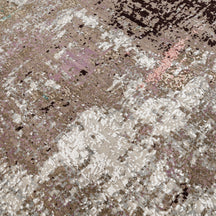 Close-up of the hand knotted wool and viscose texture with beige taupe blush aqua and blue abstract detailing