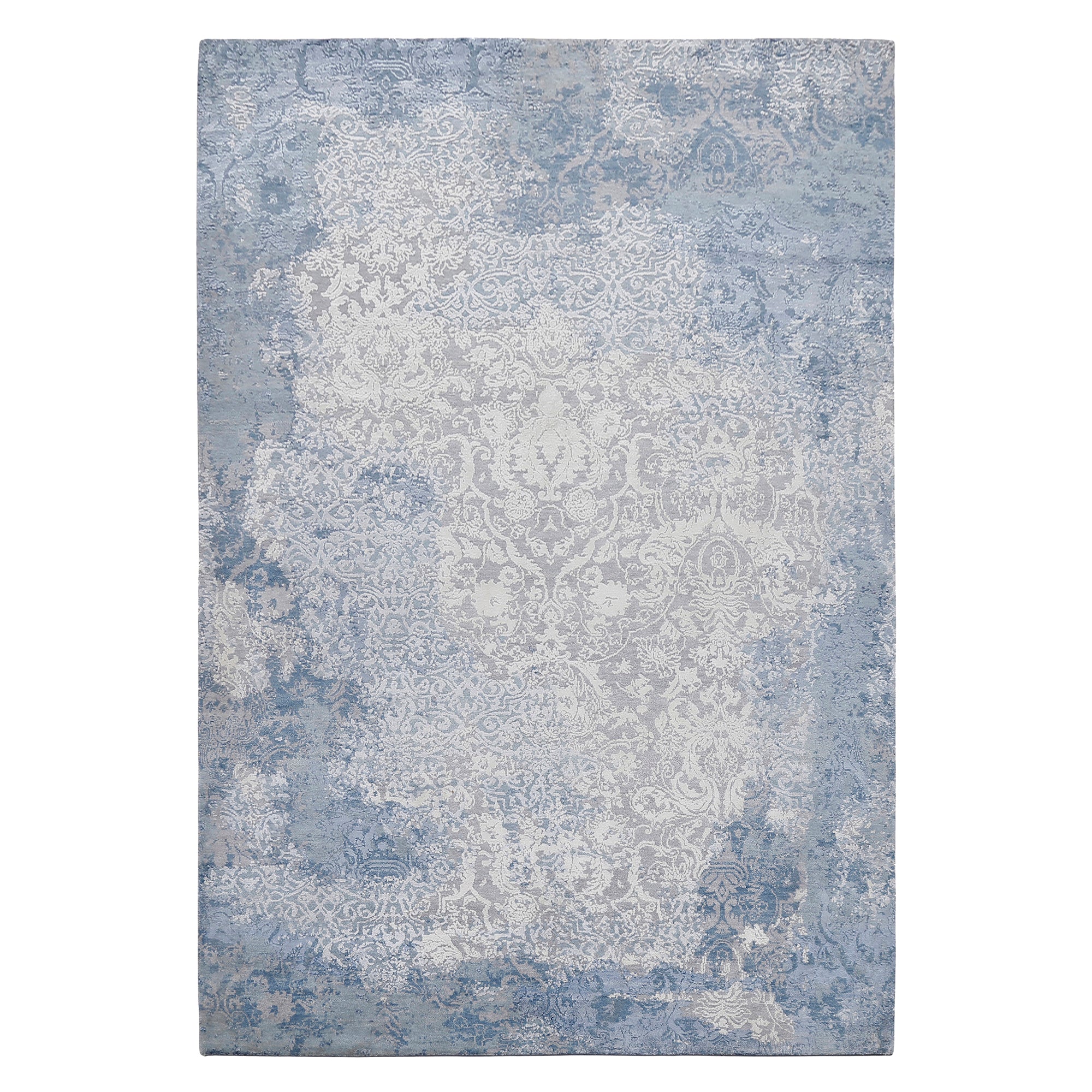 Frost blue distressed damask hand knotted wool and viscose rug with silver-grey ornamental detailing