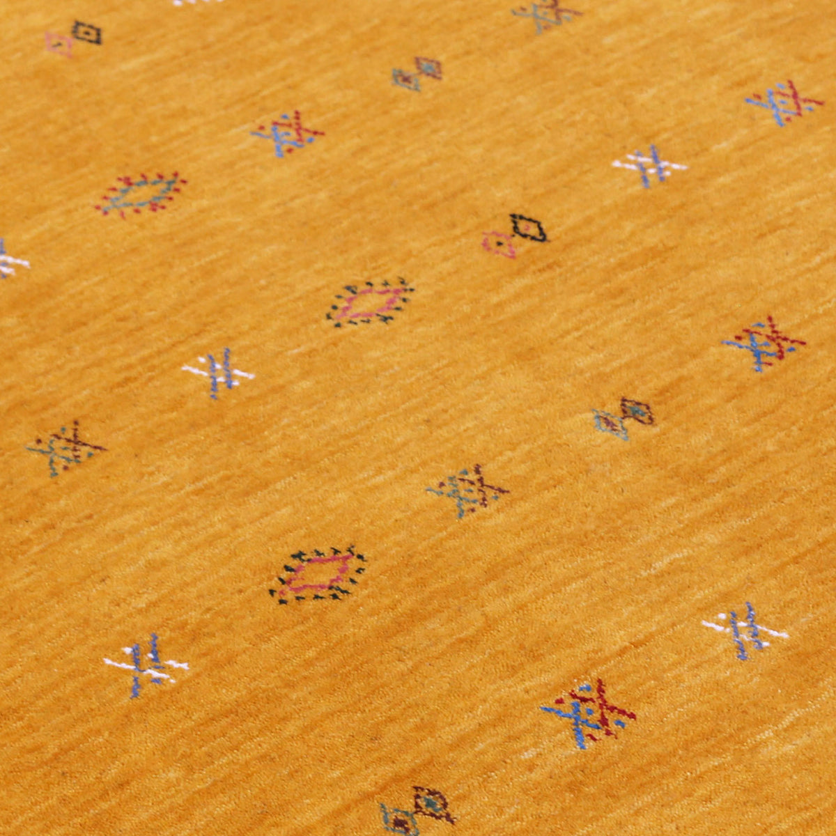 Close-up of golden mustard Hand Woven Loom Lori wool rug showing natural wool texture and multicolour geometric tribal motifs