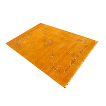 Side perspective of golden ochre Hand Woven Loom Lori wool rug highlighting handcrafted texture and central tribal medallion design