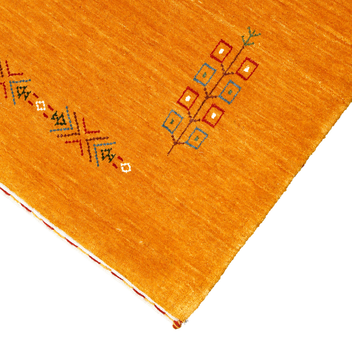 Corner and edge detail of golden ochre Hand Woven Loom Lori wool rug showing handcrafted finishing and geometric tribal detailing