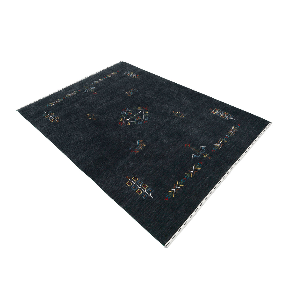Side perspective of charcoal black Hand Woven Loom Lori wool rug highlighting handcrafted texture and central tribal medallion design