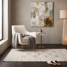 Ivory cream Hand Woven Loom Lori wool rug with stepped tribal motif panels styled in an elegant neutral living room