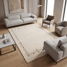 Ivory Hand Woven Loom Lori wool rug with minimal earthy tribal border styled in an elegant neutral living room