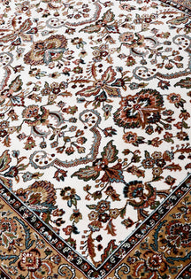 Close-up texture of Ivory Machine Woven Classic Art Silk Rug showing intricate floral motifs and smooth surface