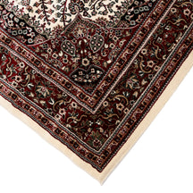 Corner and edge detail of Ivory Floral Medallion Machine Woven Classic Art Silk Rug with red ornamental border