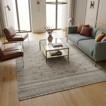 Ivory grey Hand Woven Loom Lori wool rug with scattered multicolour tribal motifs styled in an elegant neutral living room